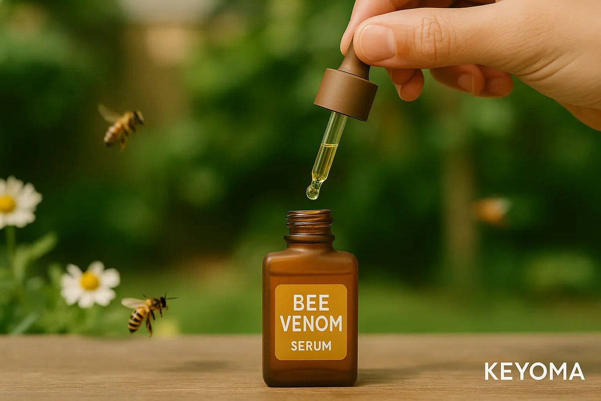 A bottle of bee venom serum with cap dropper lifted. The bottle sits on an outdoor garden table. Illustration by Keyoma