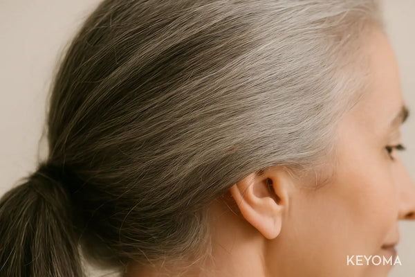 Keyoma illustration of a woman with gray, aging hair
