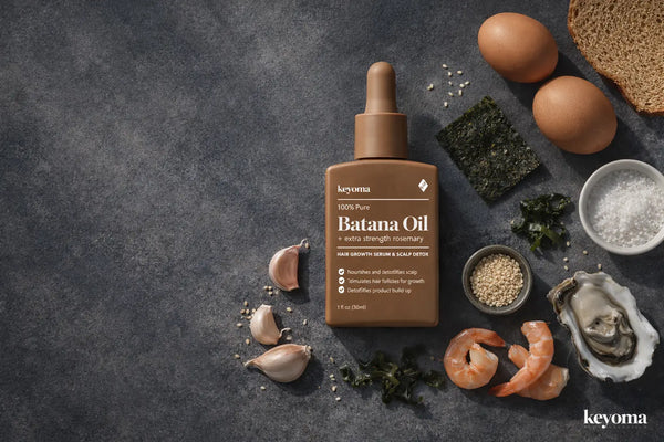 Flatlay of Keyoma Batana Oil surrounded by oysters, shrimp, garlic, and seaweed for thyroid support.