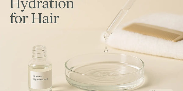 Keyoma minimal scene features a sodium hyaluronate bottle and a glass dropper releasing a bead into a dish to illustrate hydration for hair.