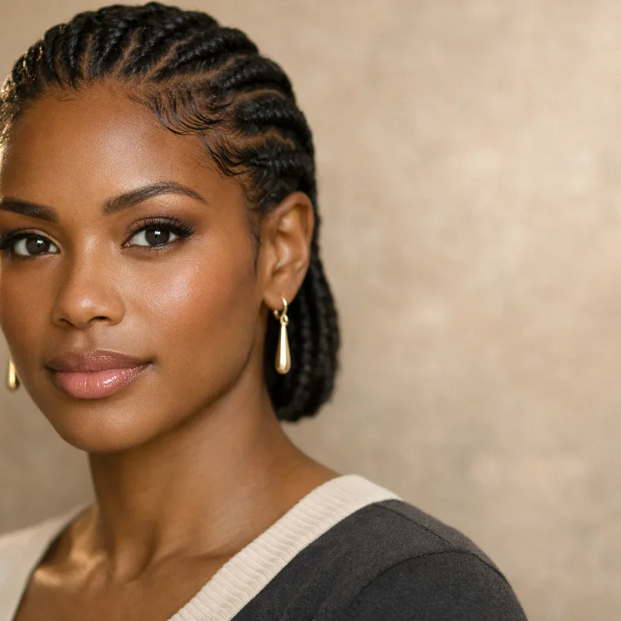 ose-up of braided protective style showing healthy hairline, representing Keyoma guidance on edge care and growth support.